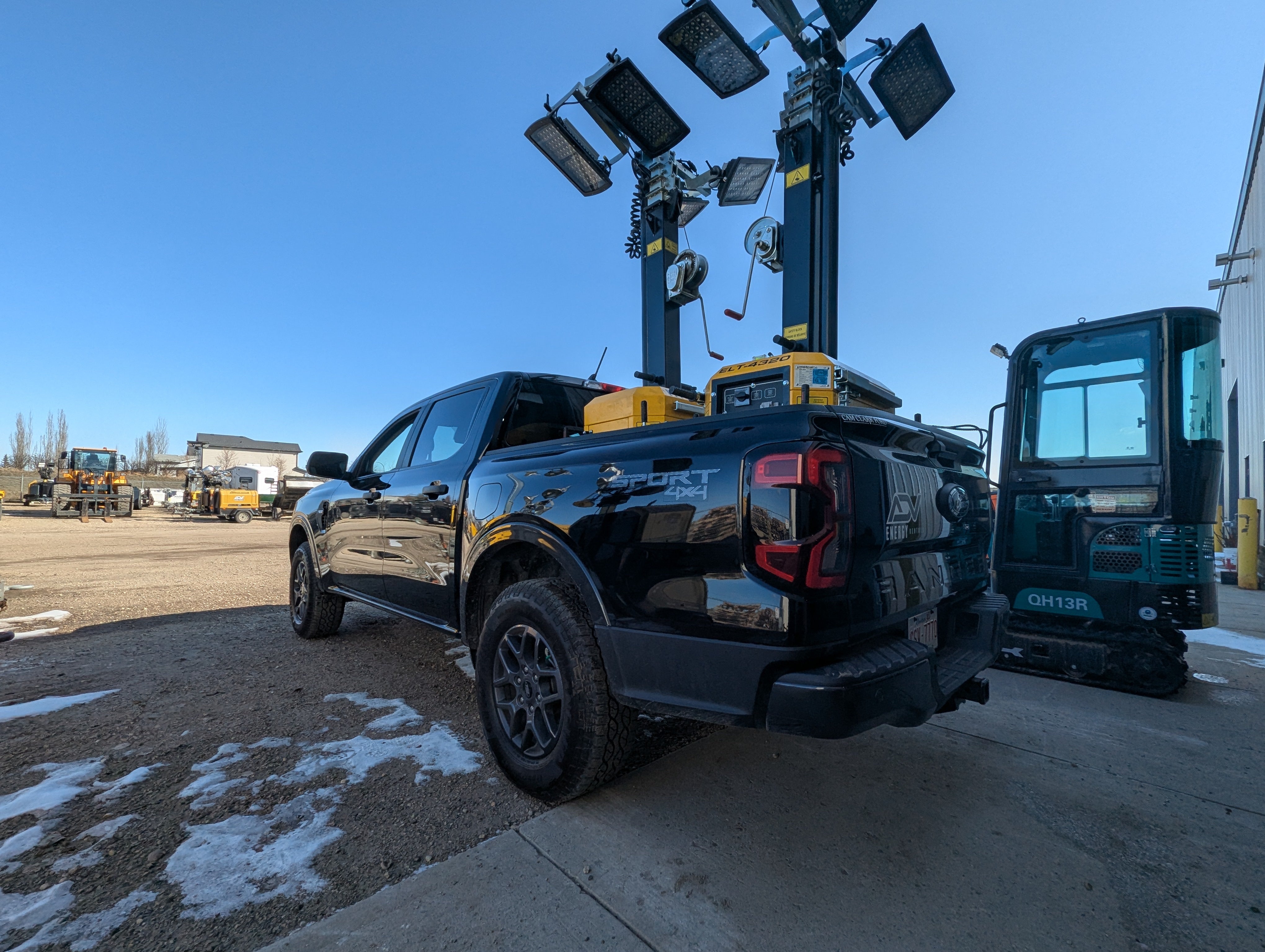 ADV Energy Rentals truck loaded with a light tower for delivery