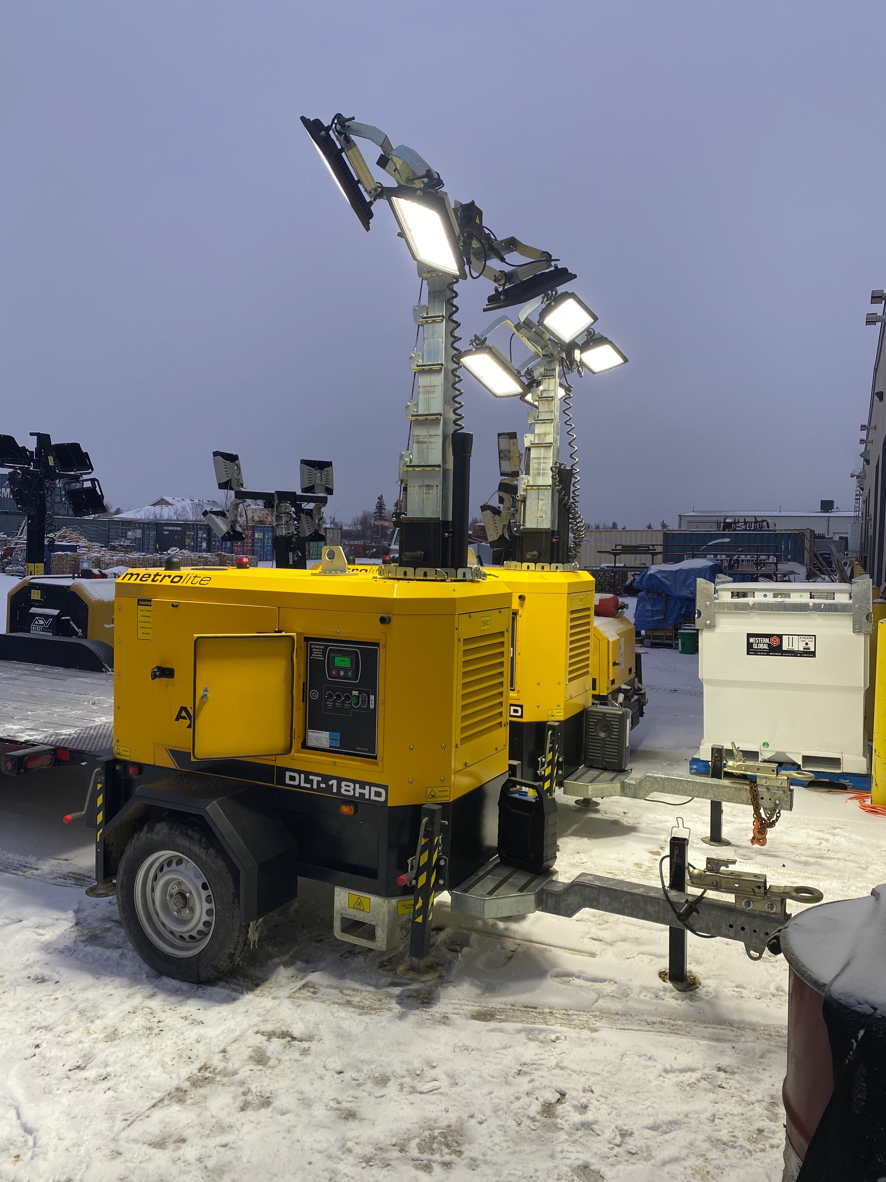 Metrolite light towers running at dusk in the ADV Energy Rentals yard, Red Deer Alberta